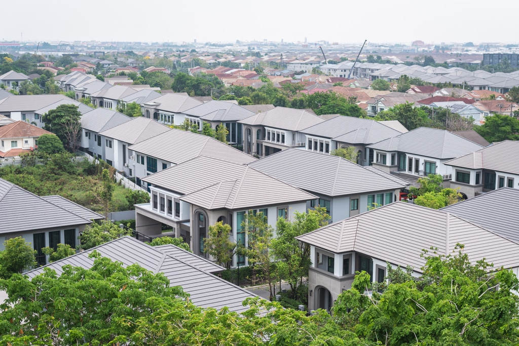 A residential area with numerous houses, showcasing a peaceful neighborhood with well-maintained homes.